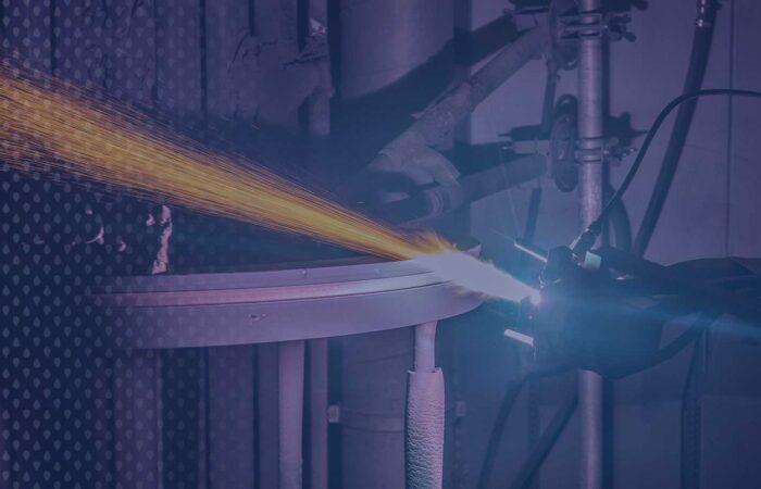 Thermal-Spray-4-blue-1950W Thermal spray robot applying coating to a ring